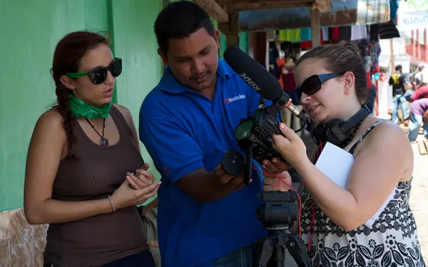 (Image: (Image: Three people looking at a camera) Courses) Courses